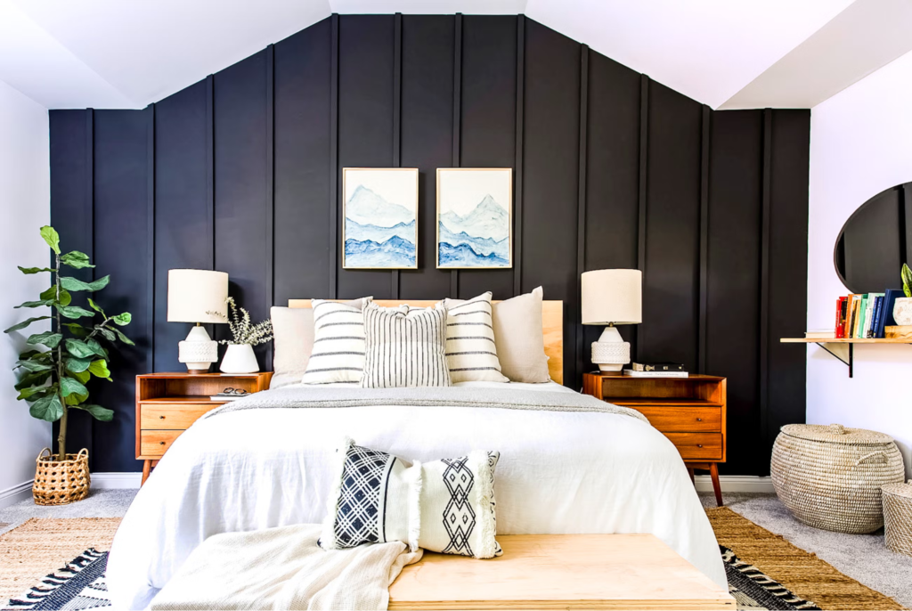 Modern bedroom with dark accent wall and vertical panel detailing by an interior painter in East Lyme, CT